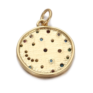 Detail of gold circular pendant with textured finish and colorful inlaid zircons