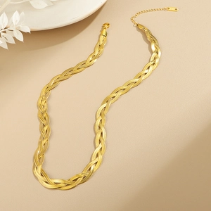 Handwoven flat gold snake chain necklace in titanium steel with 14K tag detail