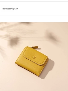 Detail of yellow lychee texture leather wallet with snap button and metal zipper