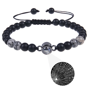 Detail of beaded projection bracelet showing 100 languages I Love You effect and matte stone