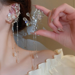 Elegant silver butterfly ear cuff with sparkling crystals and long tassel chains for women