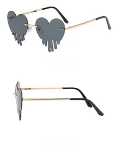 Detail of heart-shaped sunglasses featuring melting lava lenses and slim metal frames