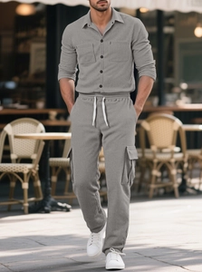 Close-up of light gray corduroy casual set with shirt collar and textured cargo pants