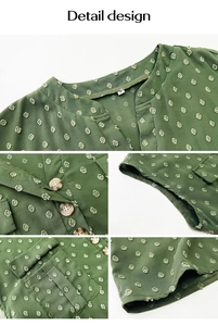 Detail of green V-neck textured shirt showing polka dot fabric and amber buttons
