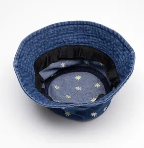 Internal view of denim bucket hat with daisy embroidery and black sweatband