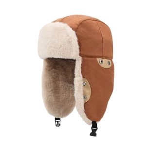 Thick brown trapper hat with cream faux fur lining and windproof chin strap for winter