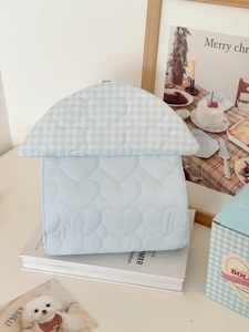 Close-up of heart-shaped quilting and blue plaid detail on the soft hanging pet tissue bag