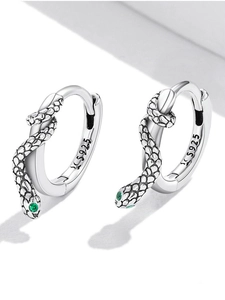 Detailed macro view of S925 sterling silver snake earrings with green zircon eyes