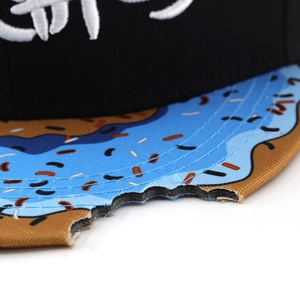 Black flat top baseball cap with donut pattern brim and white 3D embroidery detail