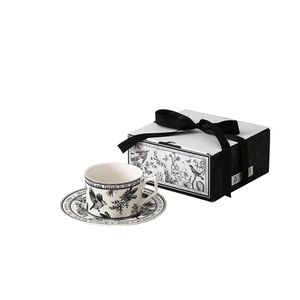 Vintage ceramic coffee cup and saucer gift set with black and white floral illustrations
