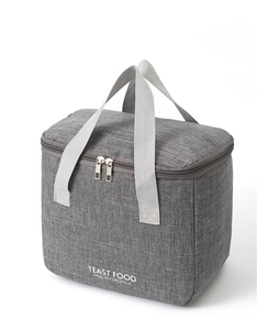 Detail view of the durable dual metal zippers and woven handles on the gray lunch bag