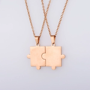 Polished rose gold puzzle piece matching couple necklaces with delicate O-chains