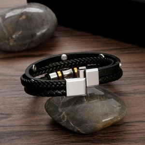 Men's braided leather bracelet with silver and gold metal beads and magnetic clasp