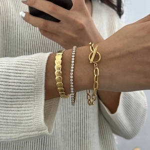 Ensemble de trois bracelets empilables en or 18 carats et argent avec zircons et fermoir OT