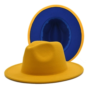Detail view of yellow wool felt fedora with a contrasting royal blue lining and clean brim