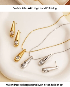 Detail of high polished 316 stainless steel water drop jewelry set with pear zircon