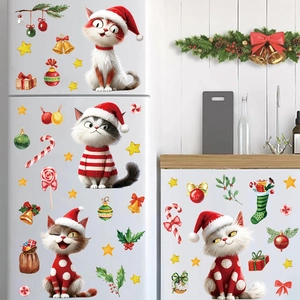 Christmas window stickers set featuring cute cartoon cats in sweaters on white fridge door