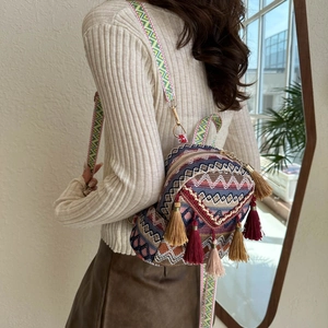 Ethnic style mini backpack with colorful geometric patterns and decorative tassels