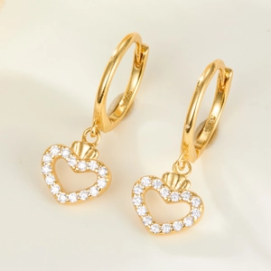 Macro detail of S925 sterling silver heart earrings with sparkling white cubic zirconia