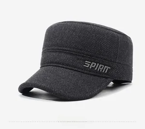 Detail of dark grey flat top military hat with SPIRIT embroidery and textured fabric