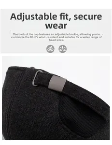 Macro detail of dark grey baseball cap with adjustable metal buckle and twill fabric