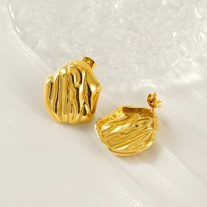 Irregular 18K gold plated stainless steel stud earrings with wrinkled texture on silk fabric