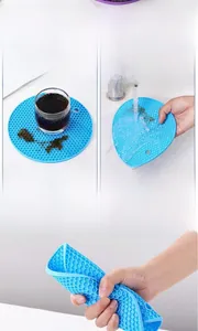 Macro detail of blue honeycomb silicone mat showing its flexible and non-slip texture