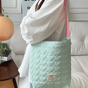 Quilted heart pattern mint green shoulder bag with contrasting pink straps for women