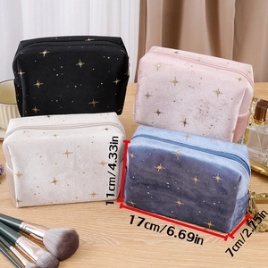Detail view of velvet cosmetic bags showing gold star patterns and size dimensions