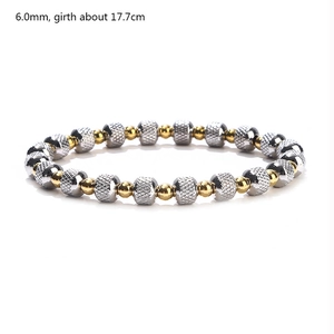 Detailed view of 6.0mm gold and silver textured metal beaded bracelet with size specs