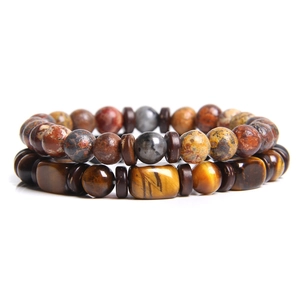 Detail of double-layer natural tiger eye stone beads and colorful round stones bracelet set