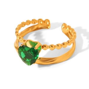 Detailed close-up of adjustable heart-cut green zircon ring with golden double-layered band
