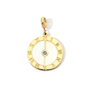 Detailed view of a gold stainless steel round pendant with Roman numerals and a center crystal