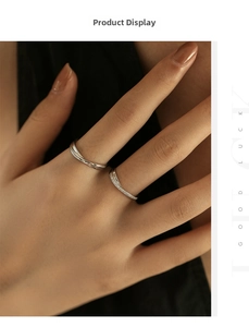 Detail of stacked S925 sterling silver Mobius rings featuring a micro-paved diamond band