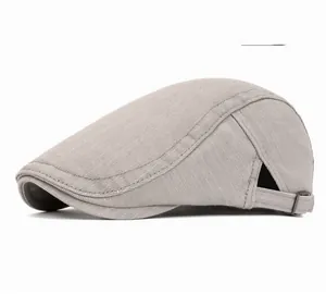 Detail view of the light grey cotton beret with adjustable side metal buckle