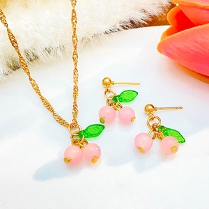 Pink cherry jewelry set with necklace and stud earrings on gold wavy chain