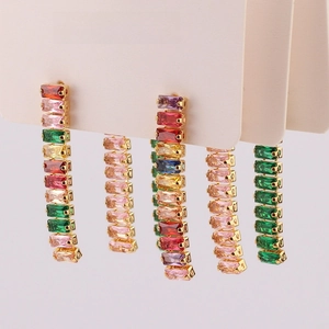 Detailed close-up of colorful rectangular zircon tassel earrings in various color combinations