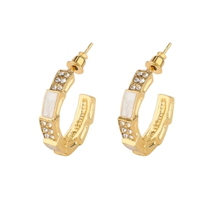 Minimalist C-shaped gold hoop earrings with white enamel and sparkling crystal stones