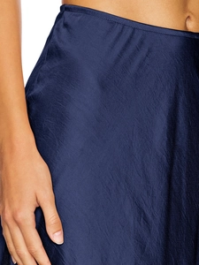 Detailed close-up showing silky satin texture and lace stitching on the navy blue skirt