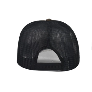 Detail of black mesh trucker hat showing breathable back with adjustable snapback closure