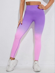 Detailed view of seamless high waist yoga leggings with purple to pink gradient pattern