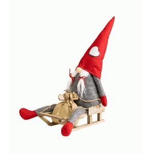 Christmas gnome plush on wooden sled with gift bag and red heart hat for holiday decor