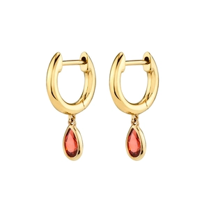 Macro detail of 18K gold hoop earrings with ruby red pear shaped zircon drop pendants