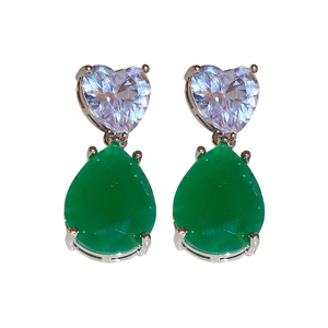 Vintage heart and teardrop silver earrings with green zircon gems on white background