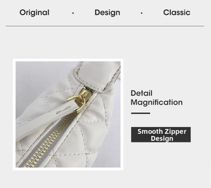 Macro detail of smooth golden zipper and white quilted leather on hula-hoop bag