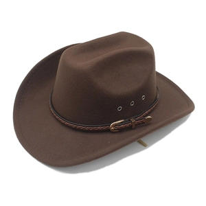 Detail of western brown felt cowboy hat showing leather band and gold buckle accents