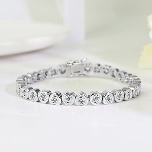 Silver heart-shaped tennis bracelet with 3A cubic zirconia in a romantic bezel setting