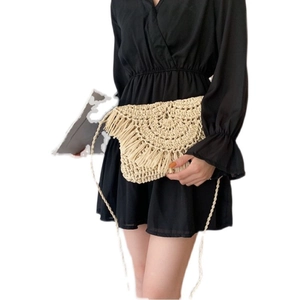 Handmade woven crossbody bag in beige with tassel detail and bohemian braided shoulder strap