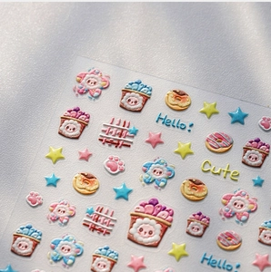 Macro detail of 3D embossed cartoon nail stickers with cute macaroon color sheep and donuts