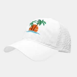 Detail of white quick-dry cap showing palm tree embroidery and laser-cut ventilation holes